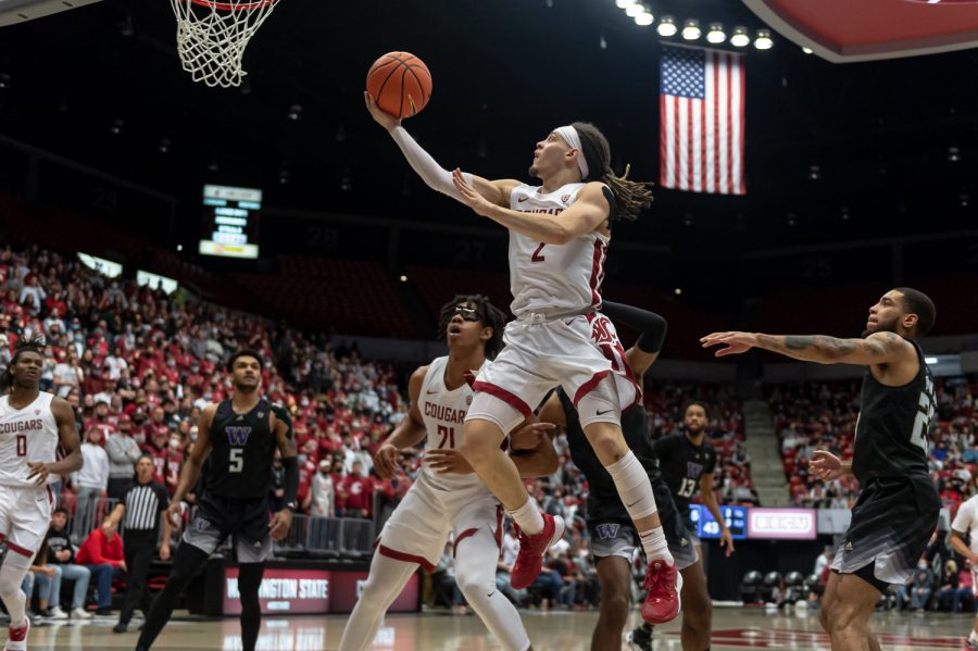 WSU guard Tyrell Roberts jumps for a layup during the second half of an NCAA college basketball game against UW in Beasley Coliseum, Feb. 23.