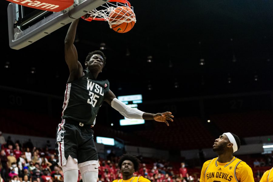 WSU forward Mouhamed Gueye dunks the ball during the second half against Arizona State in Beasley Coliseum, Feb. 12.