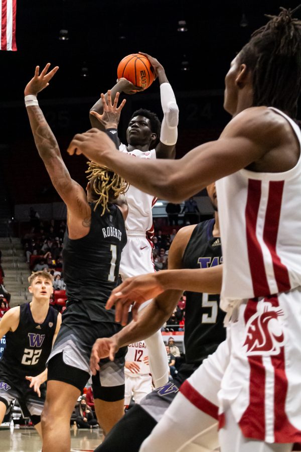 WSU forward Mouhamed Gueye shoots the ball during the second half of an NCAA college basketball game against UW in Beasley Coliseum, Feb. 23.