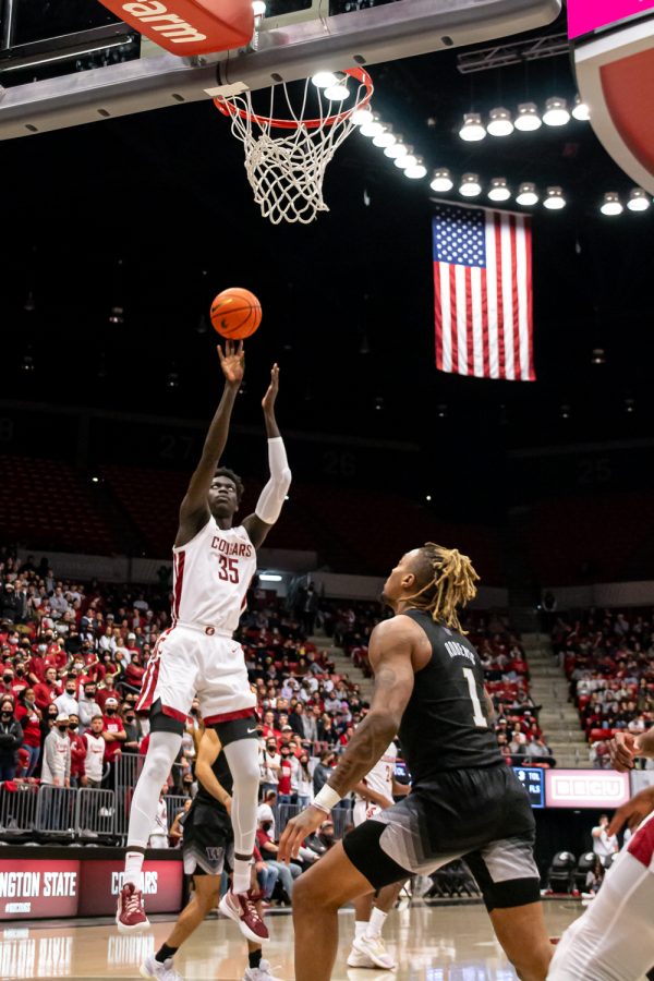 WSU forward Mouhamed Gueye (35) shoots the ball during the second half of an NCAA college basketball game aganist UW in Beasley Coliseum, Feb. 23.