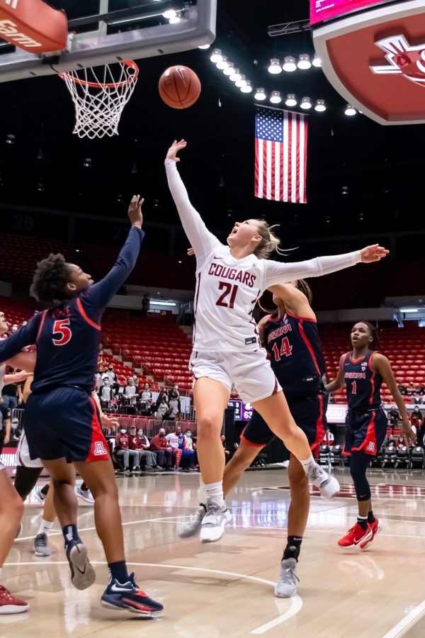 WSU guard Johanna Teder (21) jumps for a layup during the first half of an NCAA college basketball game against Arizona in Beasley Coliseum, Feb. 20.