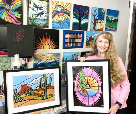 Moscow artist Polly Walker creates Stained Glass on Canvas paintings in her studio that she will display at the artwalk from 4-8 p.m. at Allegra in Downtown Moscow. Walker poses with Window View and Desert Bloom. 
