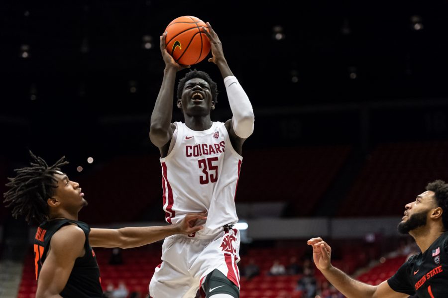 WSU forward Mouhamed Gueye (35) jumps for a layup during the second half of an NCAA college basketball game aganist Oregon State in Beasley Coliseum, March 3.