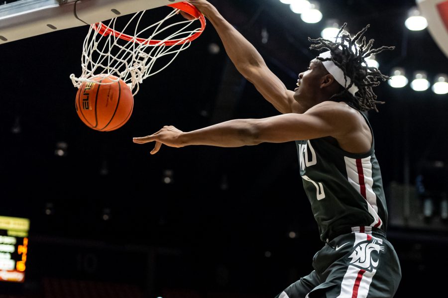 WSU forward Efe Abogidi dunks the ball during the first half of an NCAA college basketball game against Oregon in Beasley Coliseum, March 5.