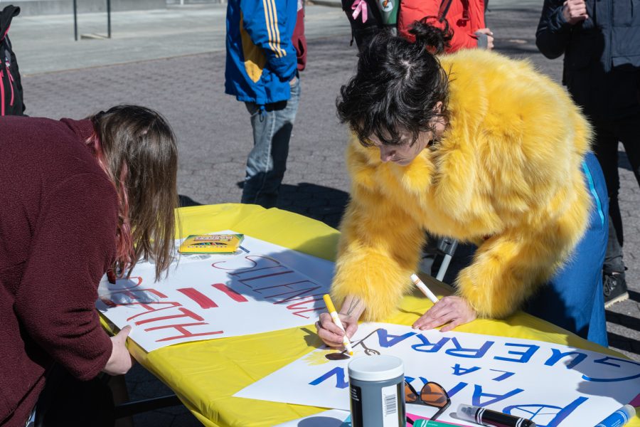 Demonstrators at the Rally for Ukraine event make posters to show their support for Ukraine, Glenn Terell Mall, March 10.