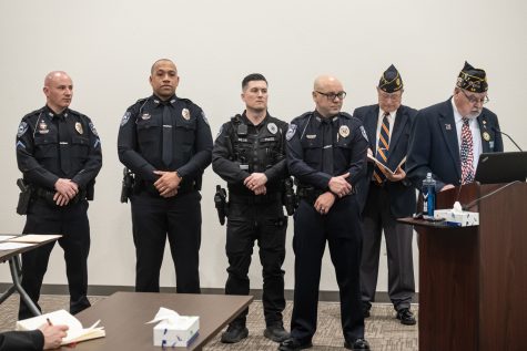 The American Legion presents an award to five police officers for their heroism during Septembers College Hill shooting at the Pullman City Coucil meeting on March 29.