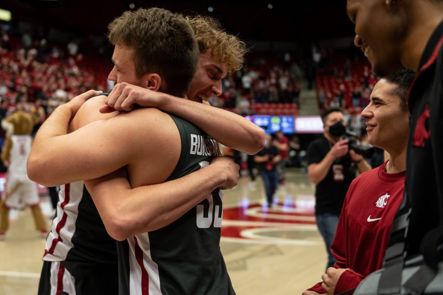 WSU guard Ryan Rapp (left) hugs guard Will Burghardt (right) after defeating Oregon 94-74 in Beasley Coliseum, March 5.