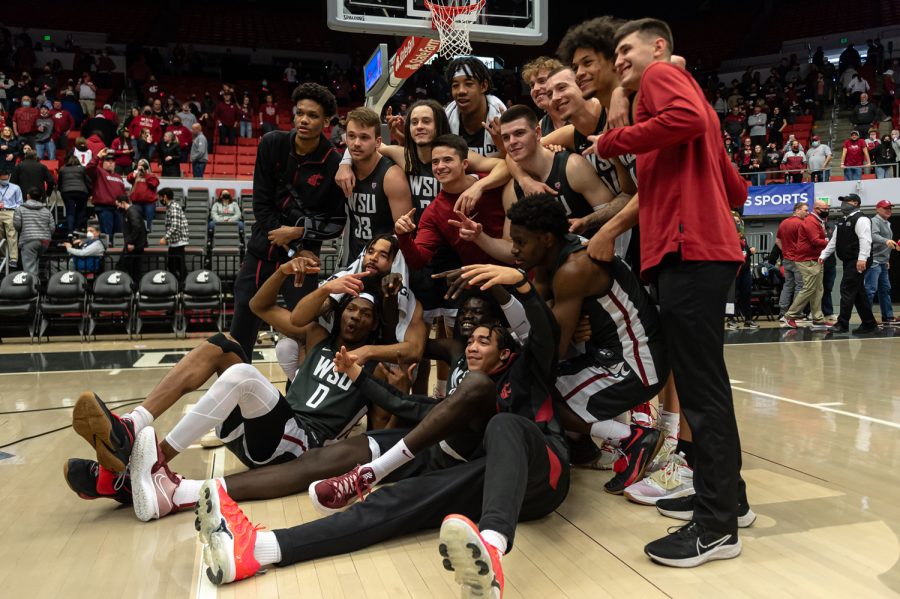 The WSU mens basketball team celebrates after defeating Oregon 94-74 in Beasley Coliseum, March 5.