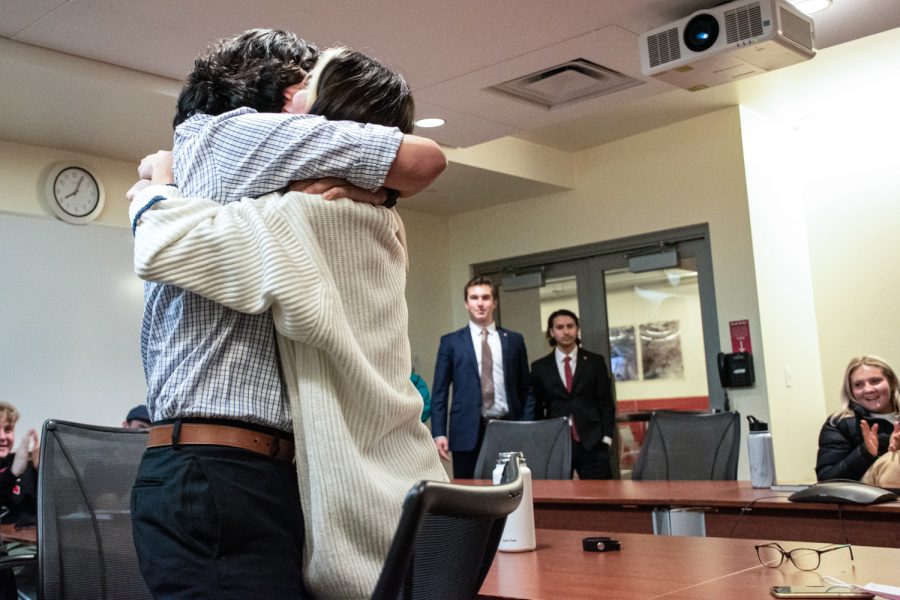 ASWSU President-Elect Jacob Martinez hugs ASWSU vice president-elect Kiana Parsi as ASWSU President Brian Patrick and ASWSU Vice President Alexander Pan enter the room to deliver the news of their win. Martinez and Parsi found out about their victory at 8 p.m. Wednesday in the Compton Union Building room 208. 