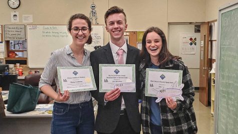 (From left to right) Emma Ledbetter, Alex McCollum and Abby Davis celebrate their awards received during The Daily Evergreens last staff meeting of the semester. 