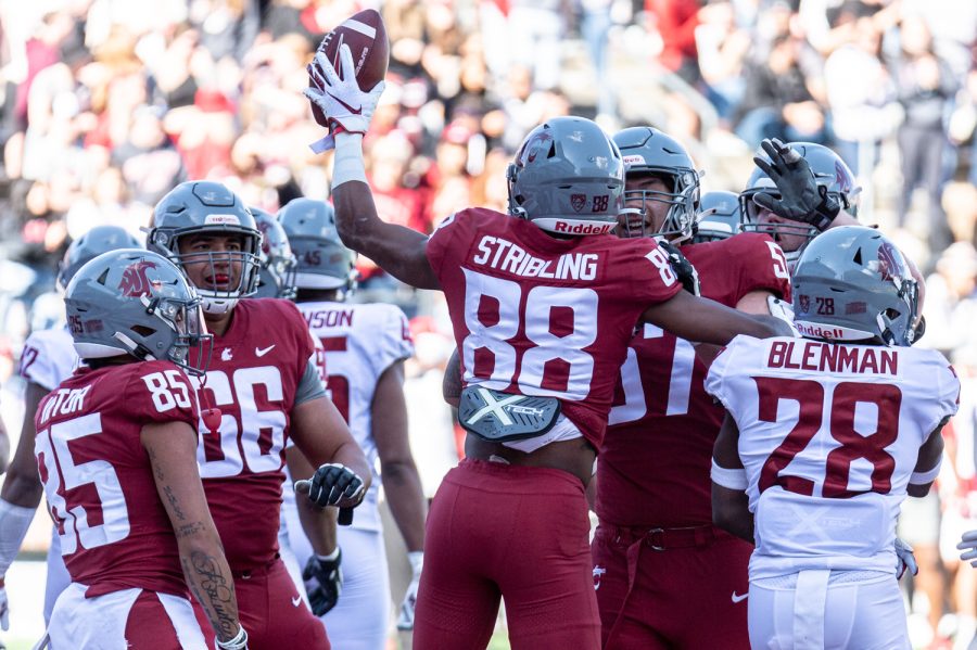 WSU wide receiver De'Zhaun Stribling celebrates with teammates after scoring a touchdown during the 2022 Spring Game, April 23, at Martin Stadium.