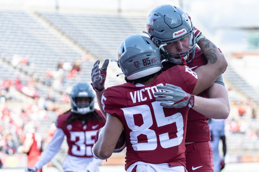 WSU wide receiver Lincoln Victor hugs tight end Andre Dollar after scoring a touchdown during the 2022 Spring Game, April 23, at Martin Stadium.