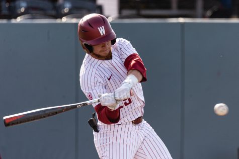 WSU outfielder Justin Van De Brake (right) swings at a pitch during an NCAA collegiate baseball game against Utah, April 1, at Bailey-Brayton Field.