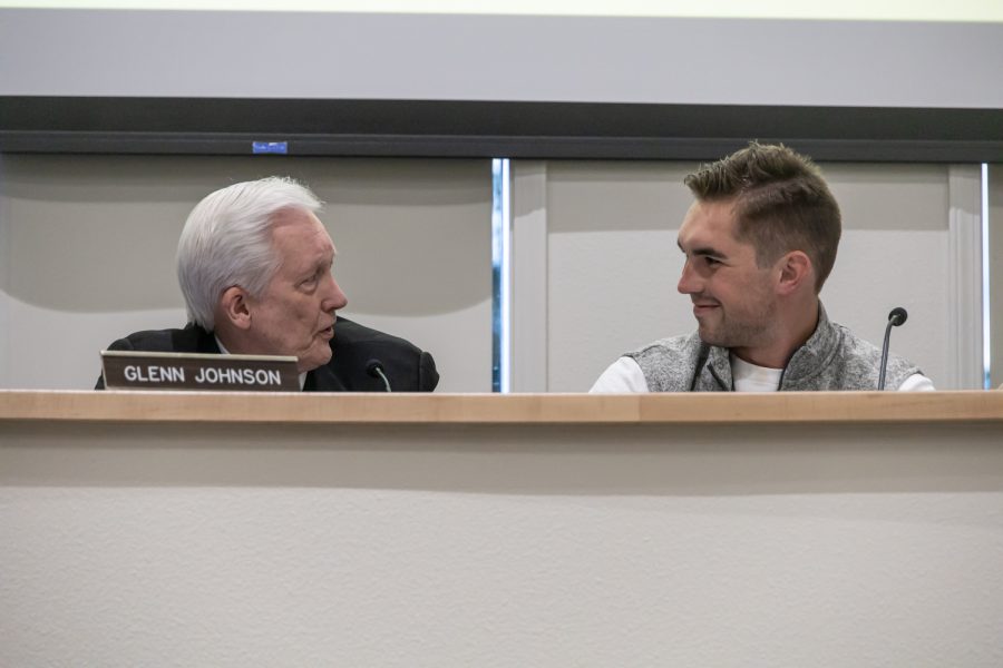Mayor Glenn Johnson (left) talks to ASWSU President Brian Patrick during a Pullman City Council Meeting, April 12.