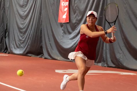 Yang Lee swings at the ball during an NCAA collegiate tennis match against UW, April 15.