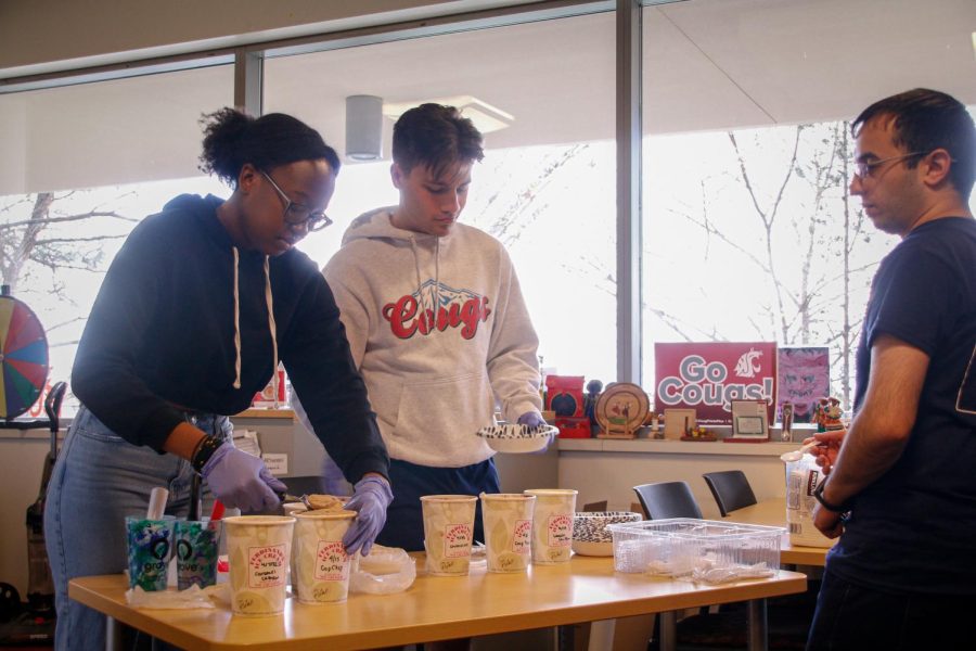 International Center Staff serve ice cream to participants, April 22.