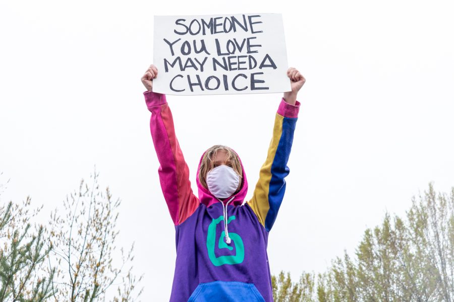 Isavan Kuiken holds her pro-choice poster high despite the rain at the Womens March Foundations Bans Off Our Bodies rally, May 14.   