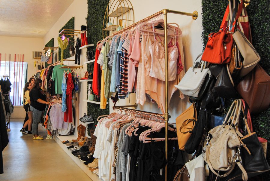 Customers look for items to buy at Michelles Closet, Aug. 27, in Pullman, Wash.