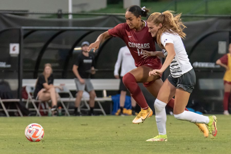 WSU forward Margie Detrizio dribbles past a Portland defender during an NCAA womens soccer match, Aug. 25, at Lower Soccer Field.