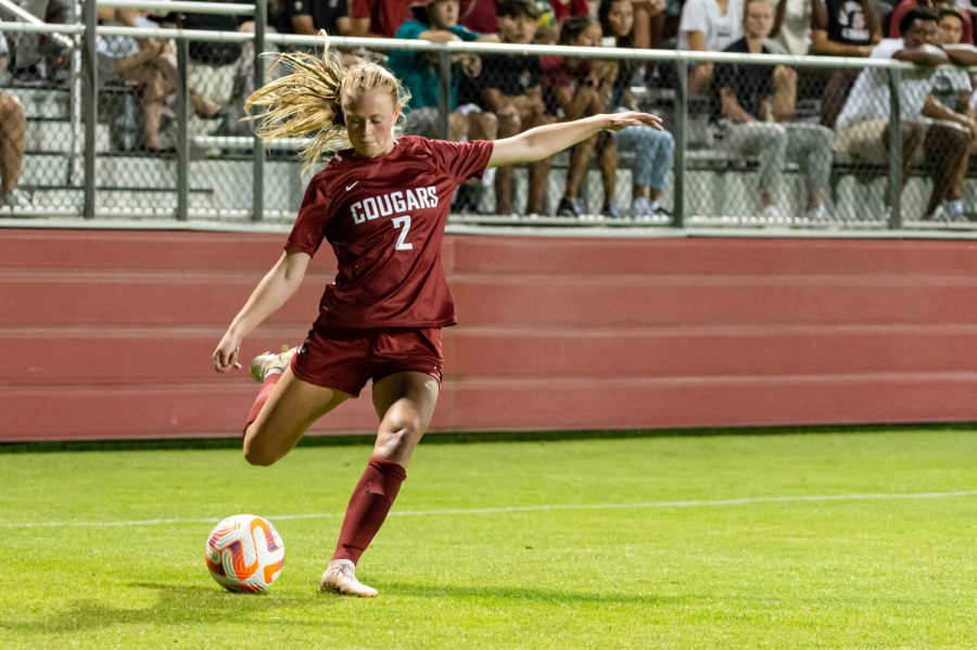 WSU defender Reese Tappan crosses the ball during an NCAA womens soccer match against Portland, Aug. 25, at Lower Soccer Field.