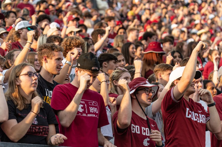 WSU students sing the WSU fight song before an NCAA football match against Idaho, Sep. 3, at Martin Stadium.