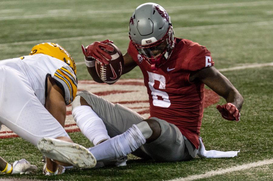 WSU wide receiver Donovan Ollie gets up after catching a pass during an NCAA football match against Idaho, Sep. 3, at Martin Stadium.
