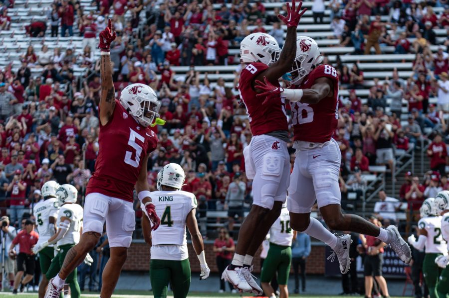WSU wide receivers Lincoln Victor (5), Renard Bell (9), and DeZhaun Stribling (88) after a touchdown during an NCAA football game against Colorado State, Sep. 17.