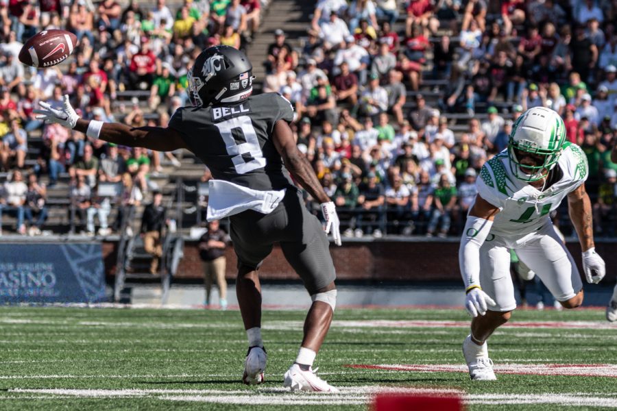 WSU wide receiver Renard Bell reaches for a pass deflected by Oregon defensive back Bennett Williams during an NCAA college football game, Sep. 24.