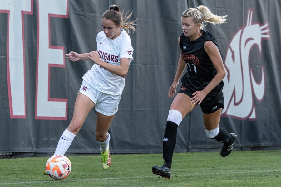 WSU forward Lily Boyden dribbles down the sideline during an NCAA womens soccer match against Denver, Sep. 5, at Lower Soccer Field.