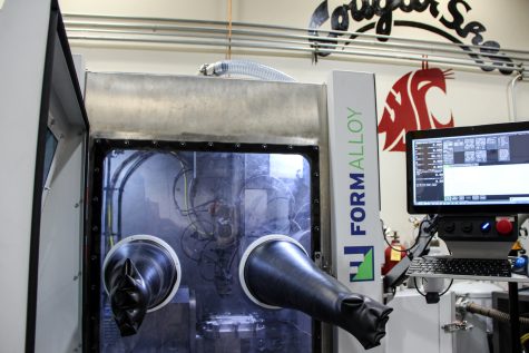 A Formalloy machine performs directed energy deposition additive manufacturing, Sep. 19.