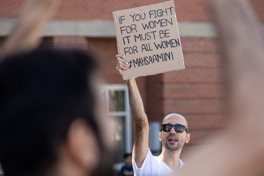Amir Moadab holds up a sign that says If you fight for women it must be all women #mahsaamini, Sept.27 on Terrell Mall.