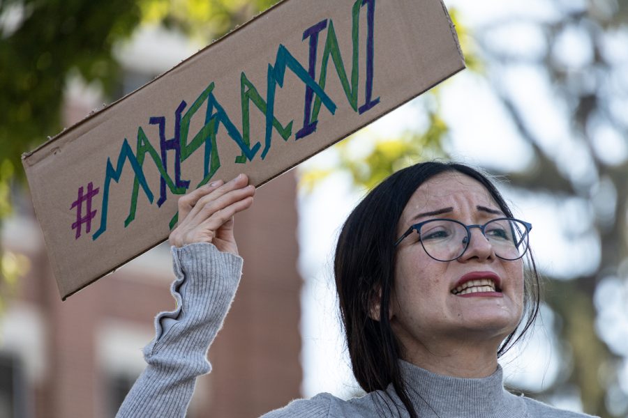 Demonstrator holding up sign that says #Mahsaamini outside Terrell Hall Sept.27.