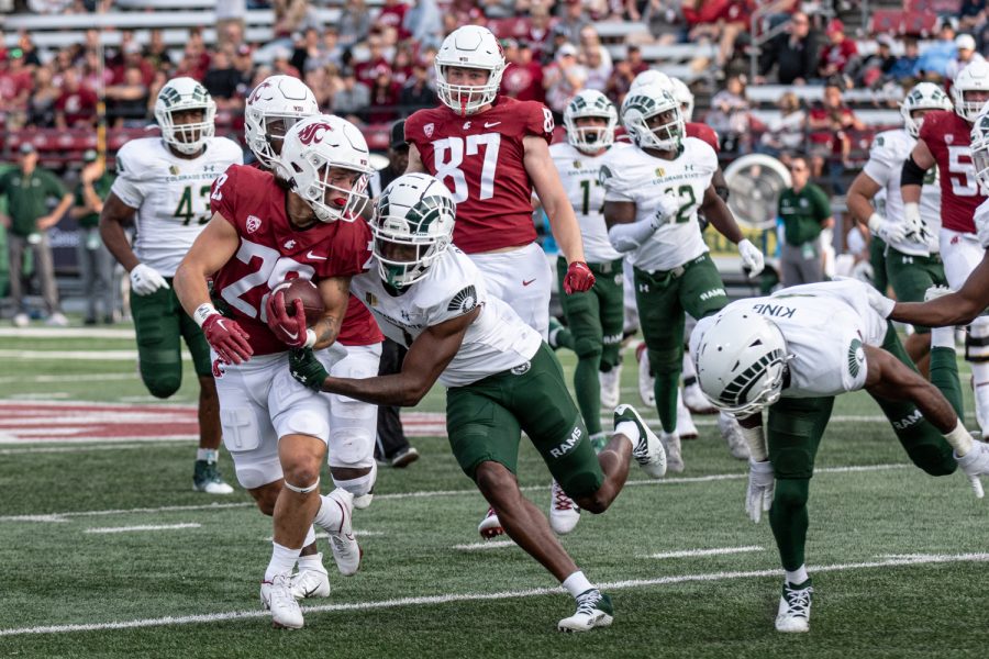 WSU running back Kannon Katzer runs past the Colorado State defense during an NCAA college football game, Sep. 17.
