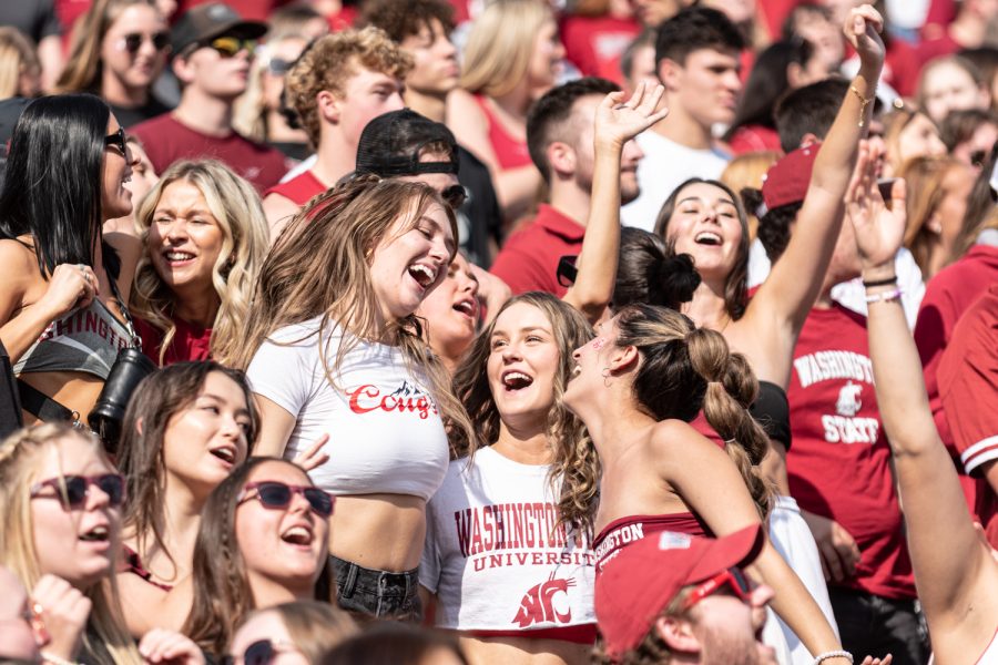 WSU fans sing “Back Home” during an NCAA college football game against Colorado State, Sep. 17.