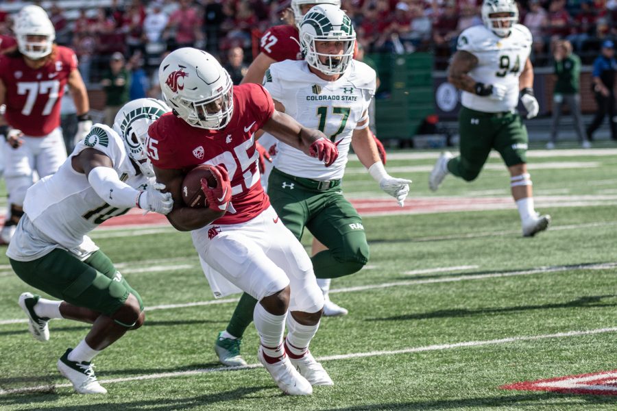 WSU running back Nakia Watson runs downfield during an NCAA college football game against Colorado State, Sep. 17.