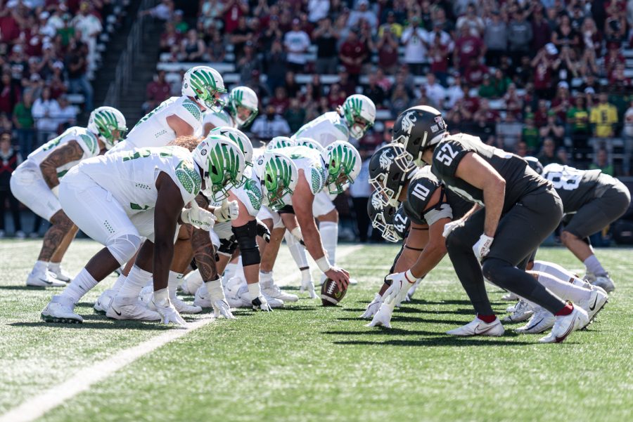 The Oregon offense and the WSU defense line up during an NCAA college football game, Sep. 24.