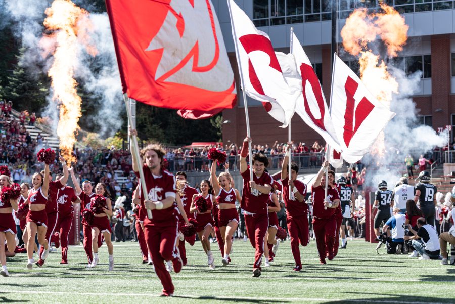 The WSU Spirit Squad leads the football team out of the tunnel before an NCAA college football game against Oregon, Sep. 24.