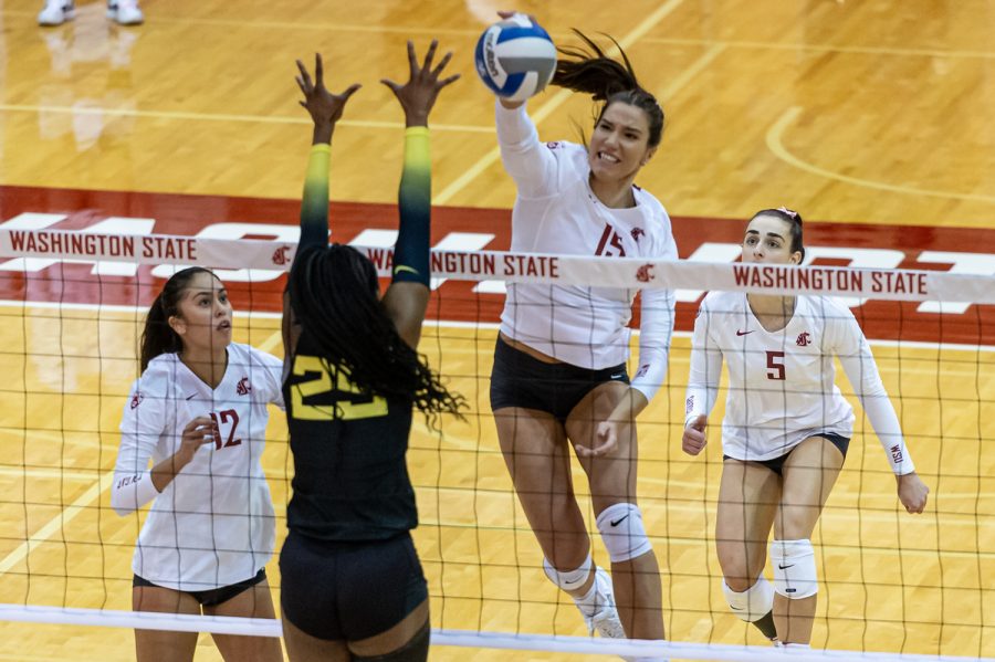 WSU middle blocker Magda Jehlarova spikes the ball during an NCAA volleyball game against Oregon, Oct. 7.