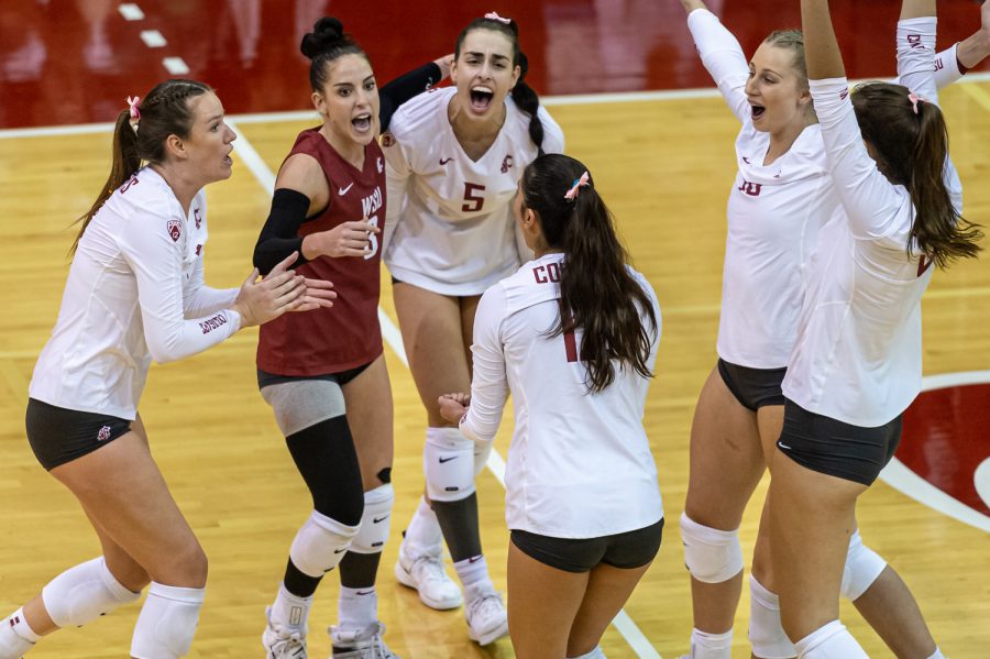 The WSU volleyball team celebrates after a point during an NCAA volleyball game against Oregon, Oct. 7.