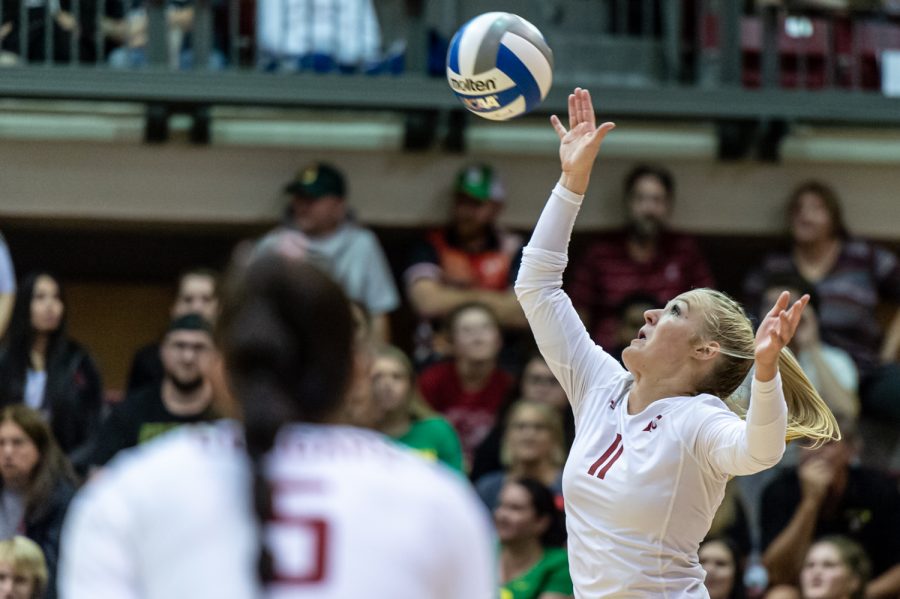 WSU defensive specialist Julia Norville serves the ball during an NCAA volleyball game against Oregon, Oct. 7.