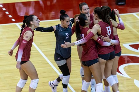 The WSU volleyball team celebrates after winning a point during an NCAA volleyball match against Arizona, Oct. 21.