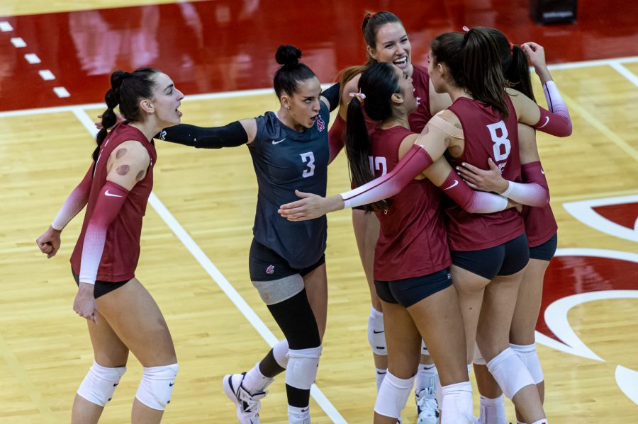 The+WSU+volleyball+team+celebrates+after+winning+a+point+during+an+NCAA+volleyball+match+against+Arizona%2C+Oct.+21.