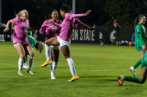 WSU forward Margie Detrizio celebrates with her teammates after scoring a goal during an NCAA womens soccer match against Oregon, Oct. 14.