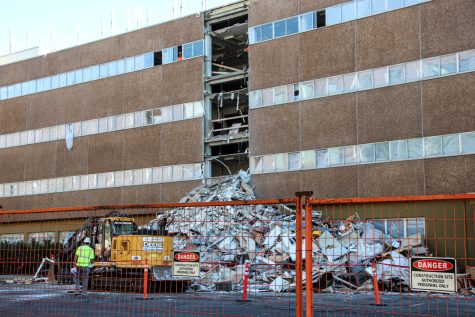 Construction workers demolish Johnson Hall, Oct. 4.
