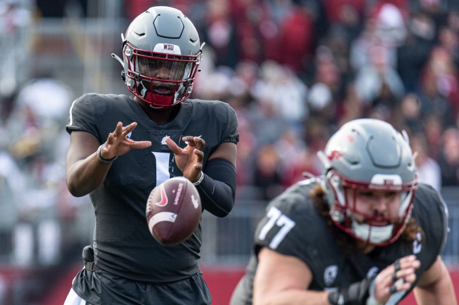 WSU+offensive+lineman+Konner+Gomness+snaps+the+ball+to+quarterback+Cameron+Ward+during+an+NCAA+football+game+against+Arizona+State%2C+Nov.+12.