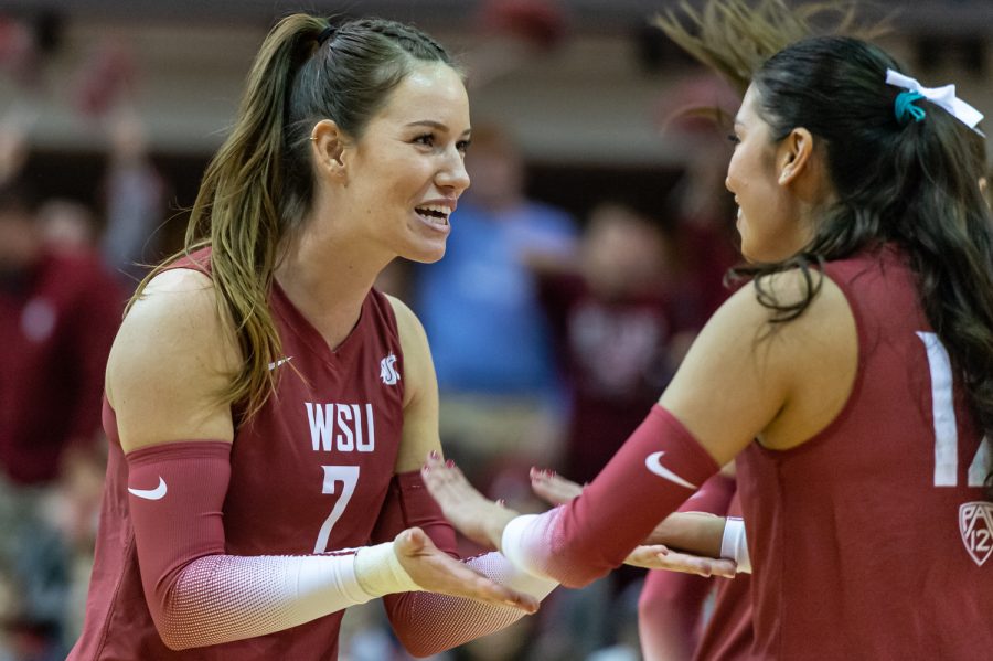 WSU+outside+hitter+Pia+Timmer+%28left%29+and+setter+Argentina+Ung+%28right%29+celebrate+after+scoring+a+point+during+an+NCAA+volleyball+match+against+UW%2C+Nov.+25.