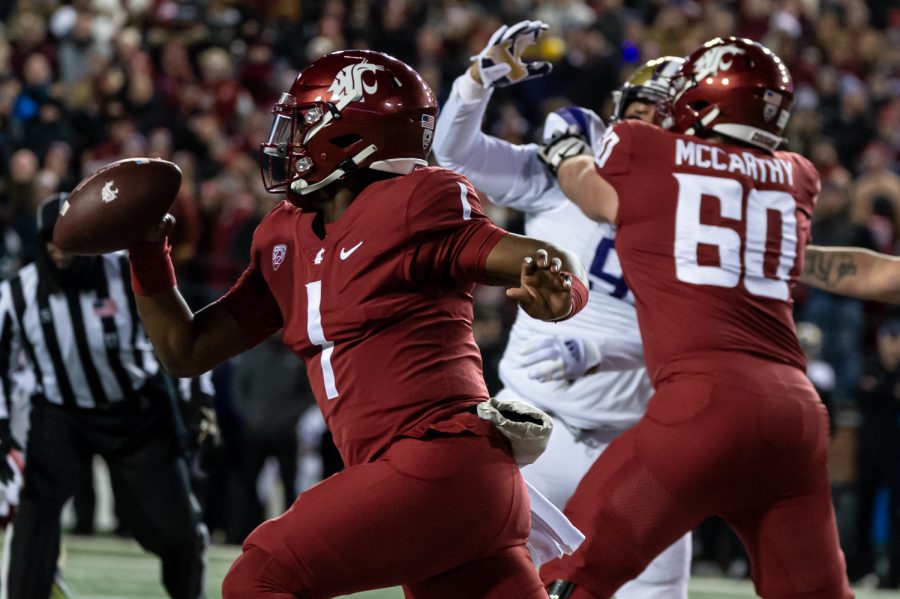 WSU quarterback Cameron Ward runs out of the pocket during the Apple Cup, Nov. 26.