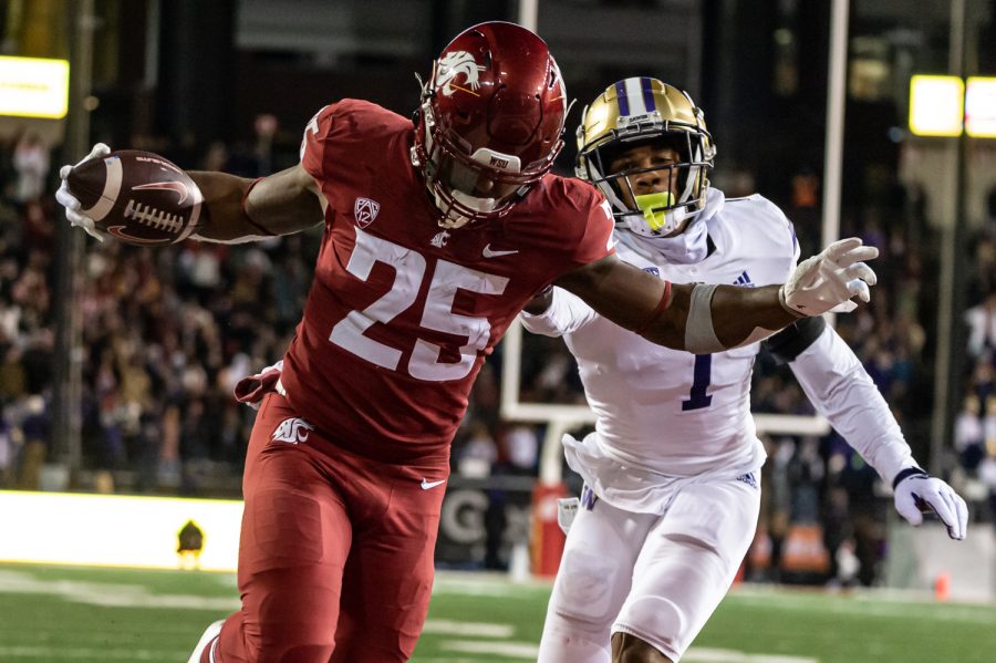 WSU running back Nakia Watson scores a touchdown during the Apple Cup, Nov. 26.