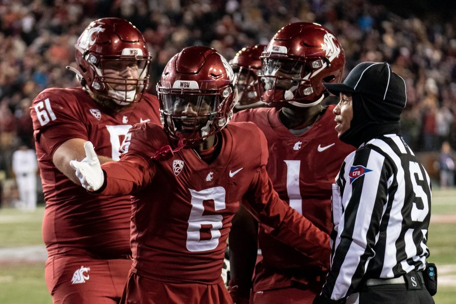 WSU wide receiver Donovan Ollie argues with a referee after a failed two-point conversion during the Apple Cup, Nov. 26.