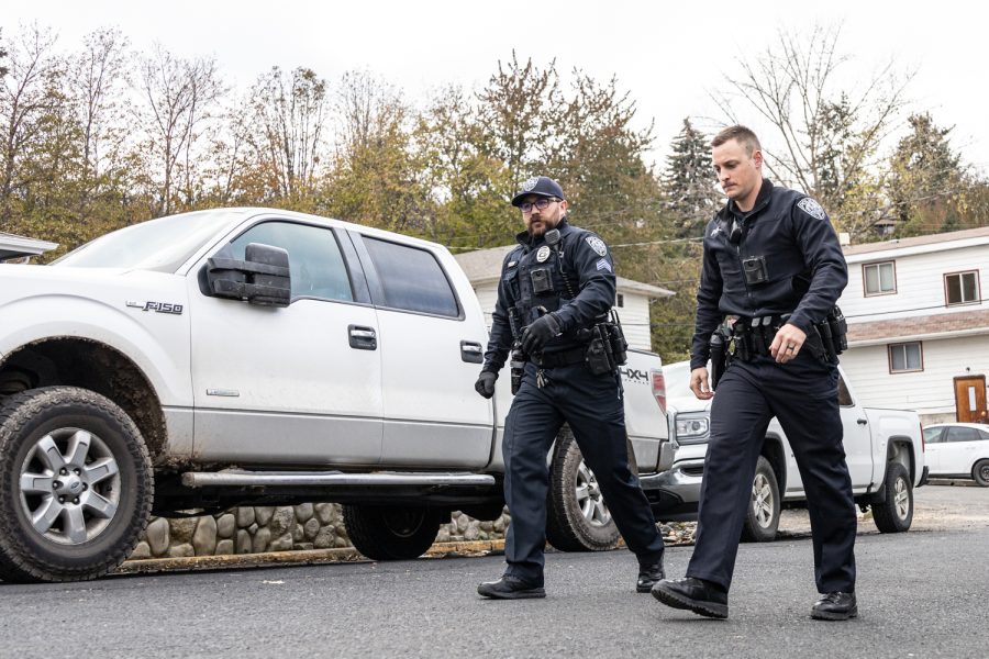 Two Moscow Police Department officers walk down King Road toward the scene of a possible homicide at an apartment complex near the University of Idaho, Nov. 14, in Moscow, Idaho. 14, in Moscow, Idaho.